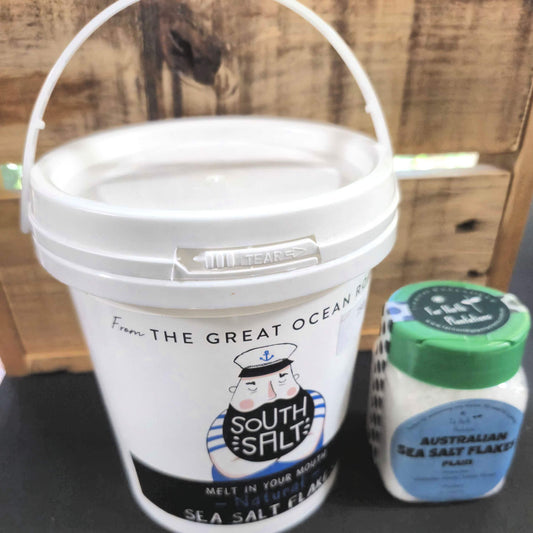 Australian Sea Salt Flakes in white bucket with sailor logo plus smaller shaker pack with green lid